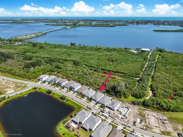 Minutes from the beach with protected land touching the rear of the property which adds to the privacy... location, location, location and NO flood insurance required