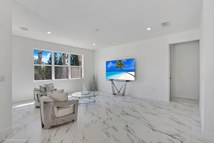 Beautiful upgraded over-sized tile throughout with triple window allowing a multitude of natural light