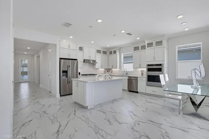 A move-in ready kitchen with all appliances included and with a 5-burner natural gas cook top...just bring your pots & pans