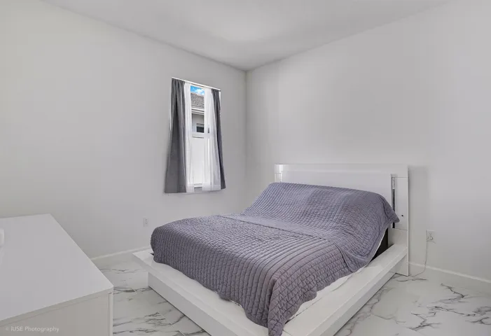 Secondary bedroom with upgraded tile floors