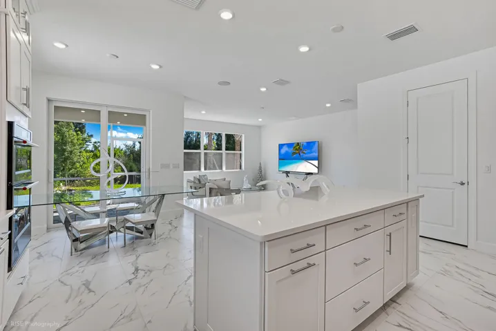 Open concept living space that allows the living area to flow into the dining area and kitchen