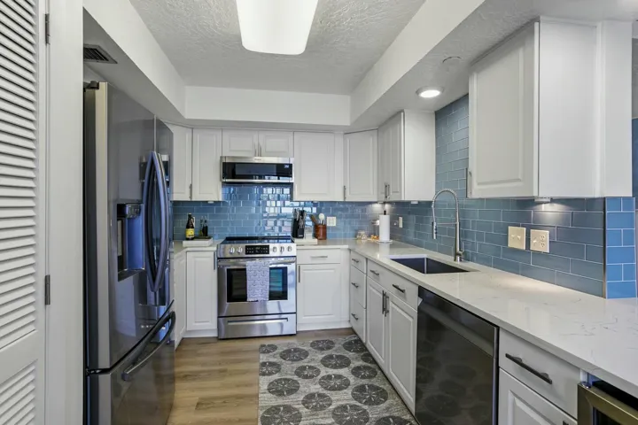 Beautifully updated kitchen with all stainless steel appliances, wine refrigerator and plenty of cabinet space.