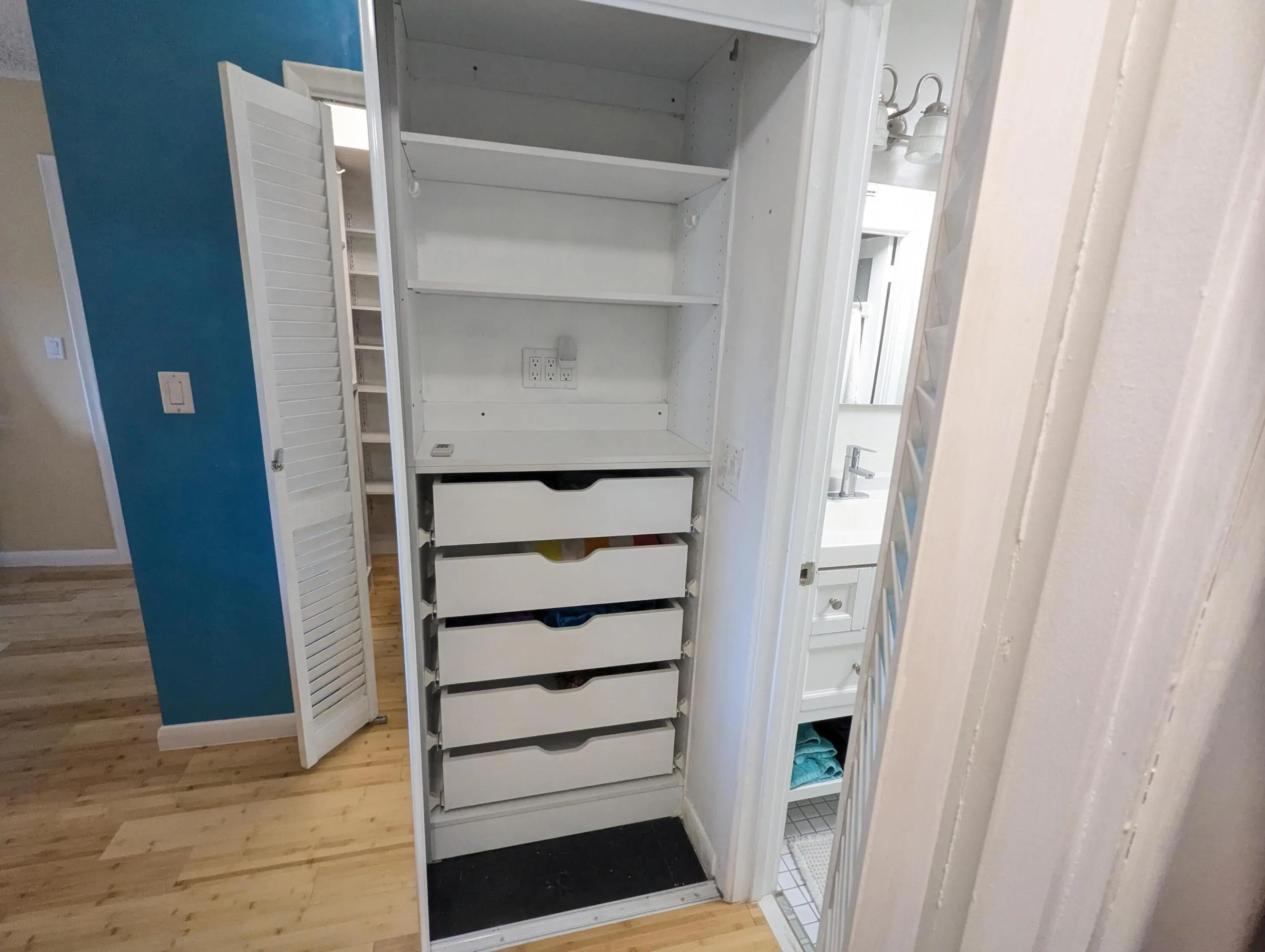 Hall closet between bedroom and bath.