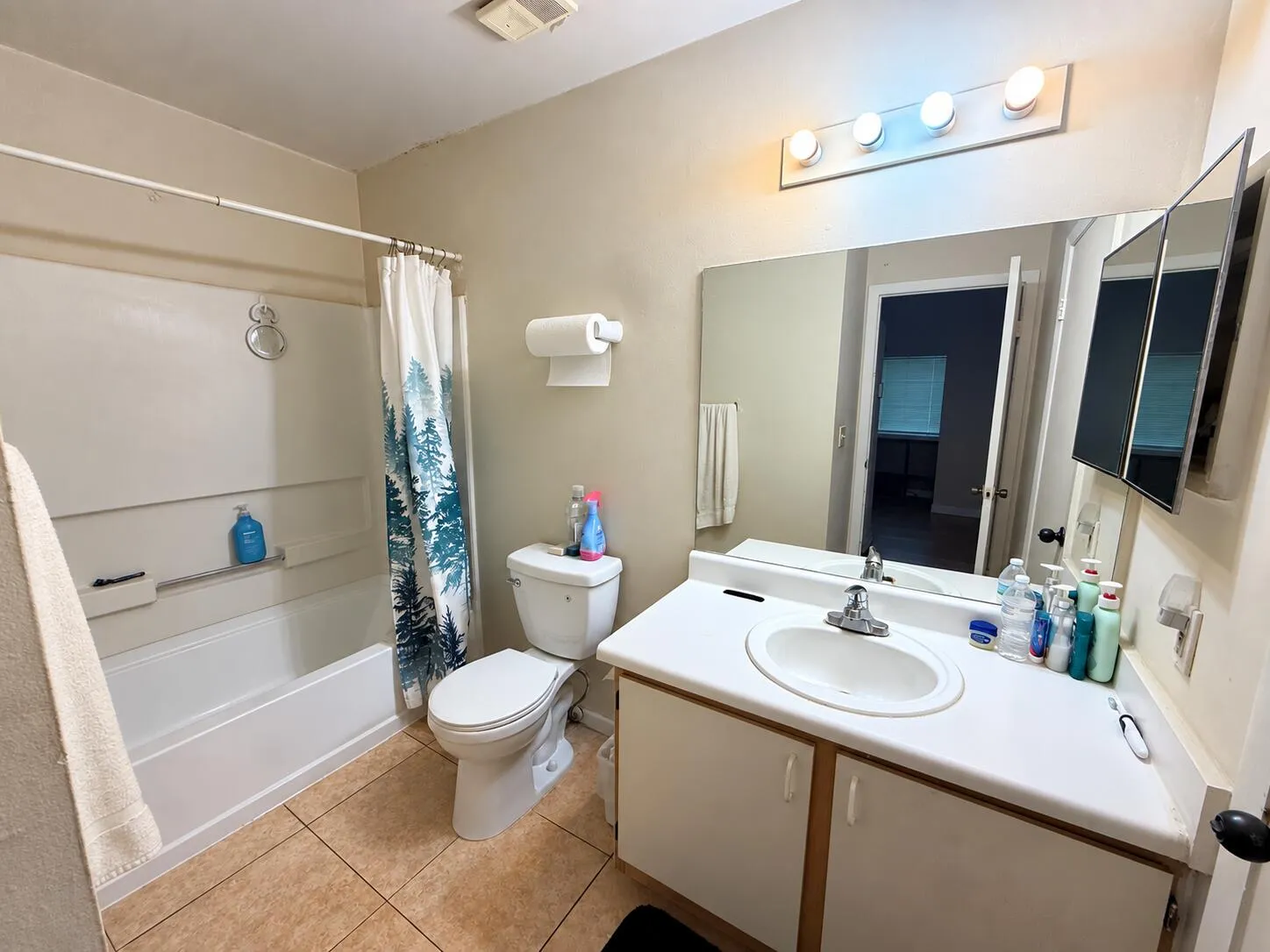 Clean Beige Bathroom with Forest Shower