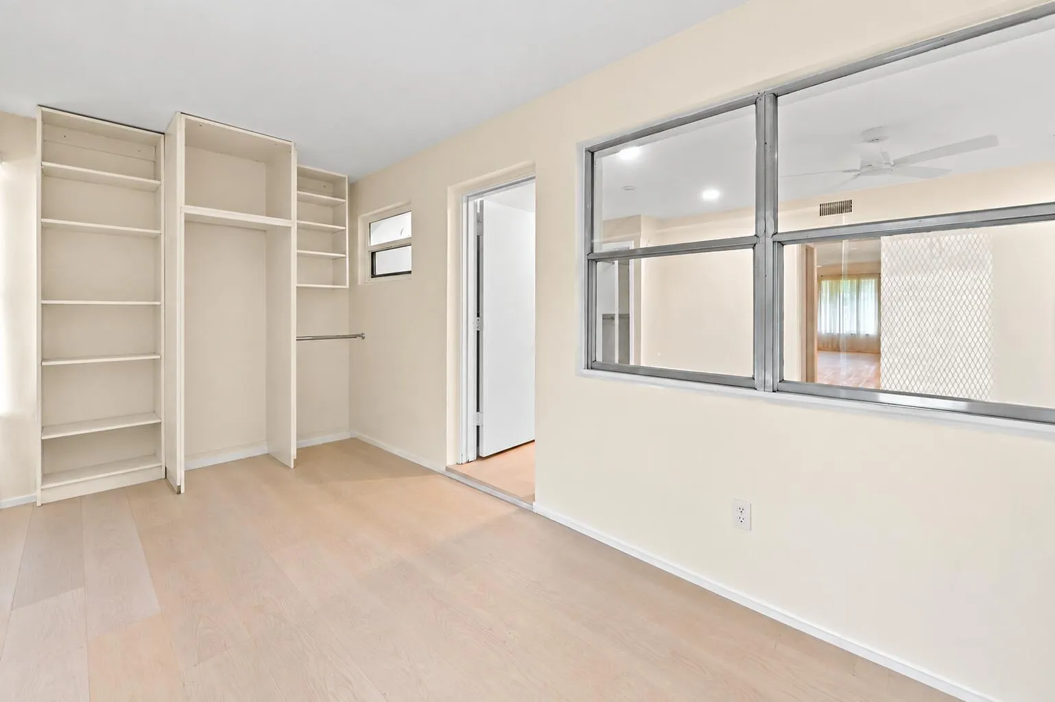 Decluttered sunroom with empty shelves