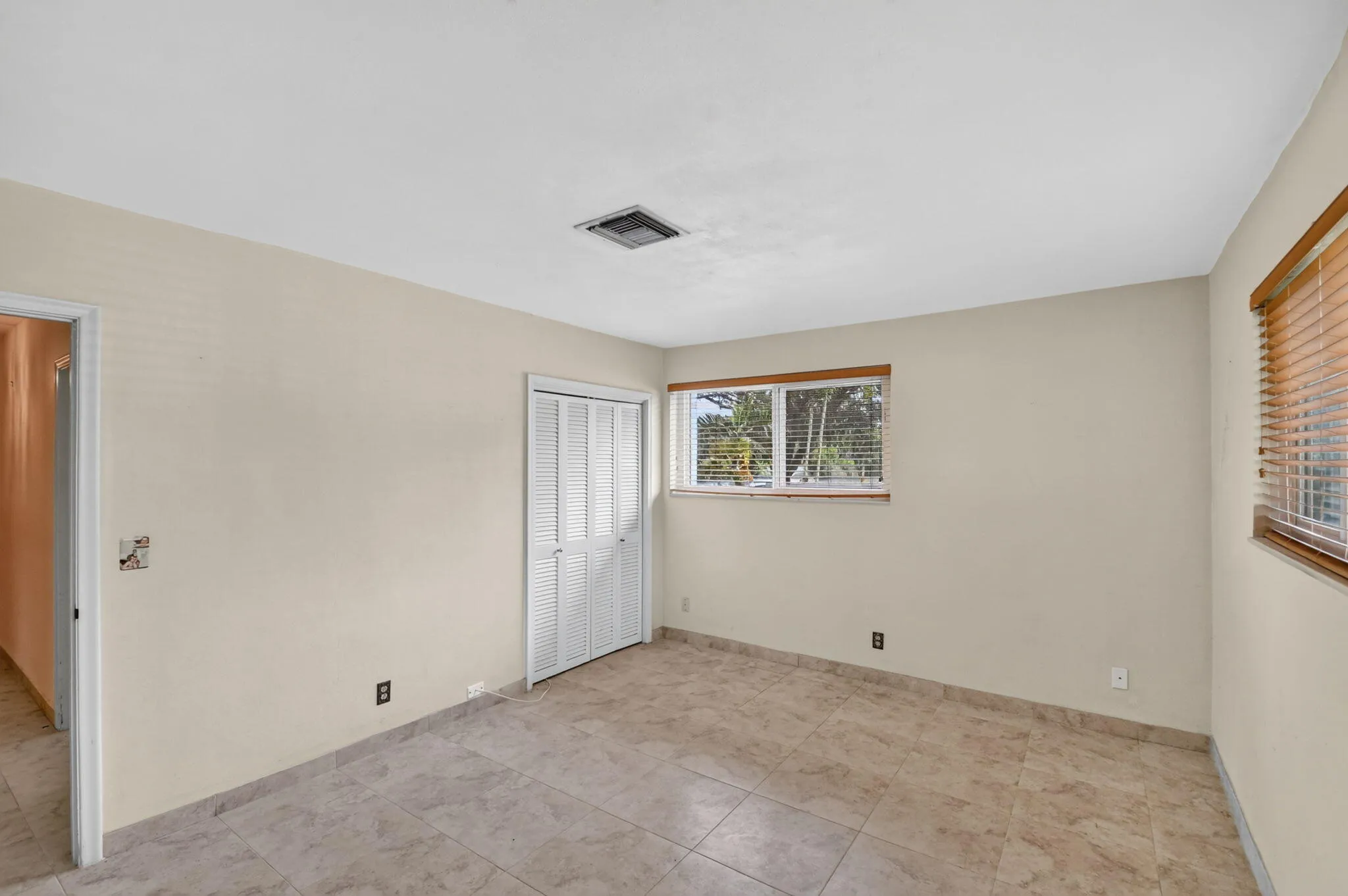 Neutral tone walls with tile flooring