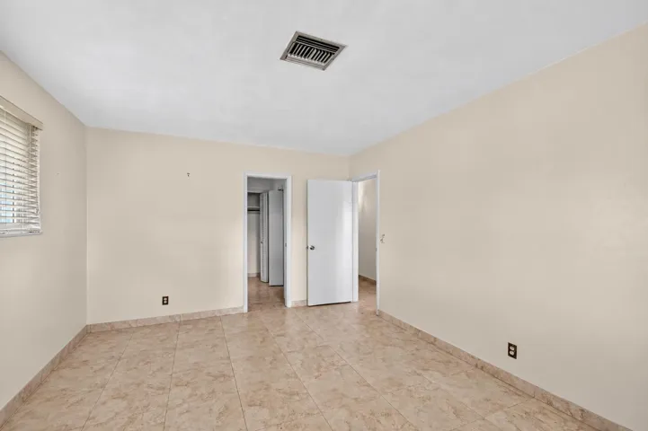 Empty Neutral Room with Open Doors