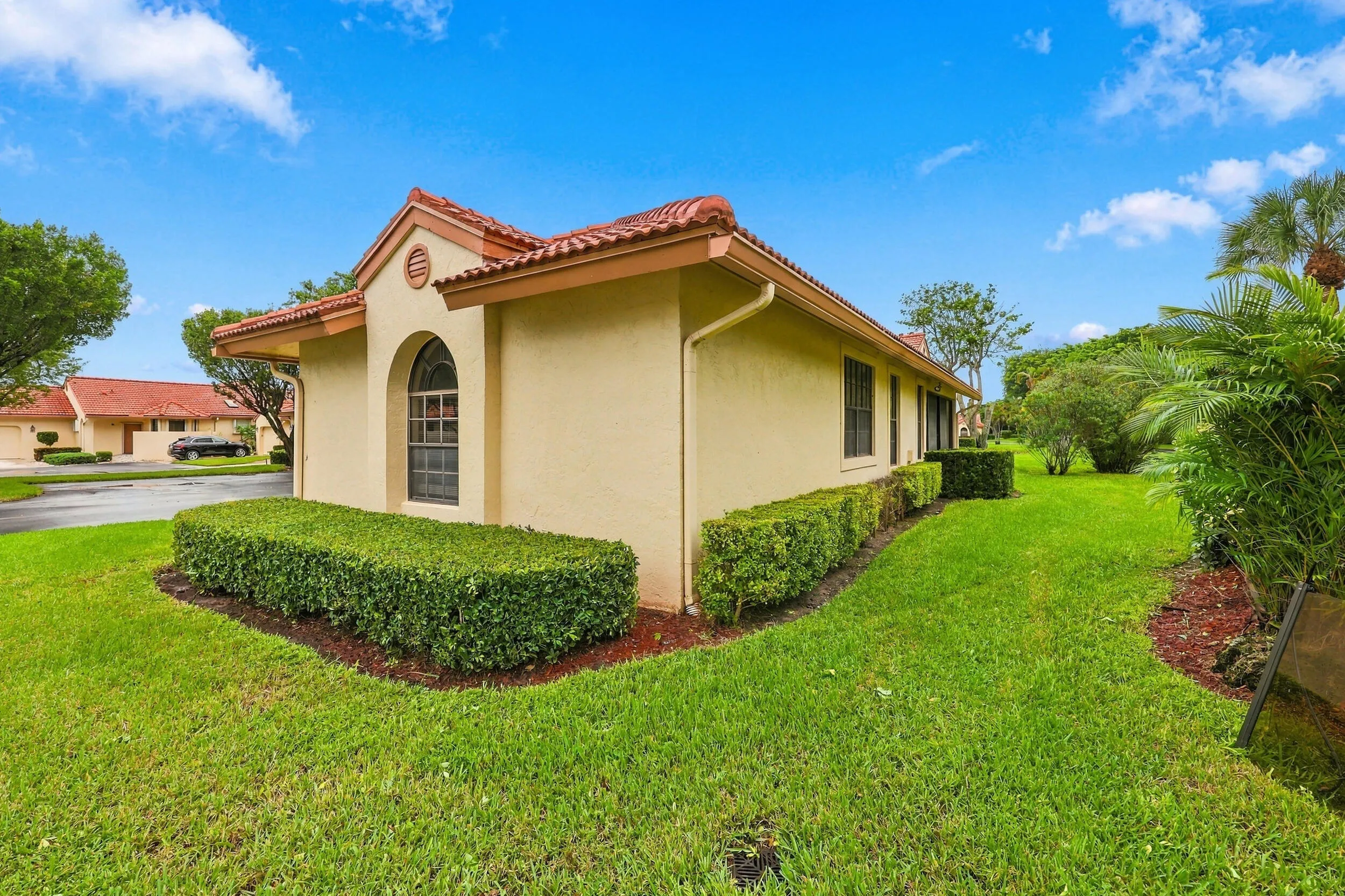 Stucco exterior with a terracotta tile roof