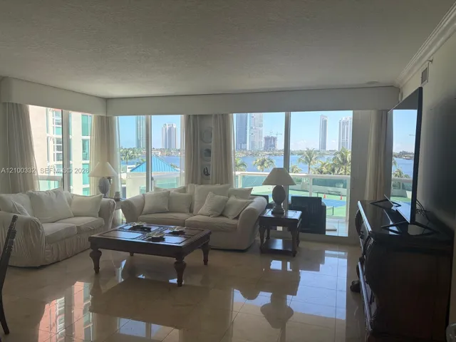 Expansive windows with water and cityscape scenery