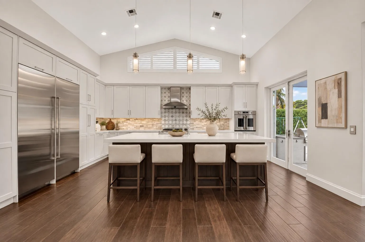 Refined neutral kitchen with ivory stool
