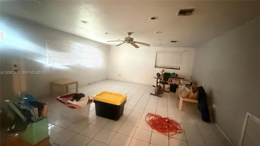 Previously a garage with a front door but connected to house