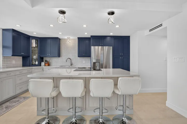 Island, soft close cabinets, pantry, decorator fixtures and endless views.