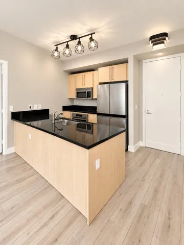 Freshly painted Kitchen with stainless steel appliances.