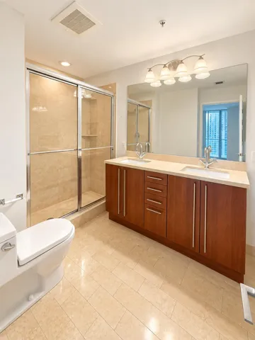 Primary bathroom with double vanity sinks. Separate shower and soaking tub.