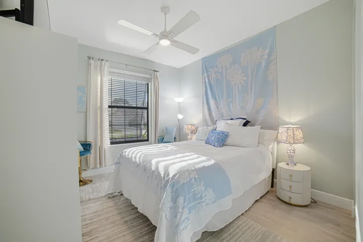 Recessed lighting, ceiling fan, wood-finish flooring, window with blinds, and light-toned walls