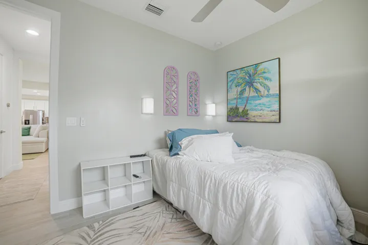 Recessed lighting, ceiling fan, hard-surface flooring, and wall-mounted sconces