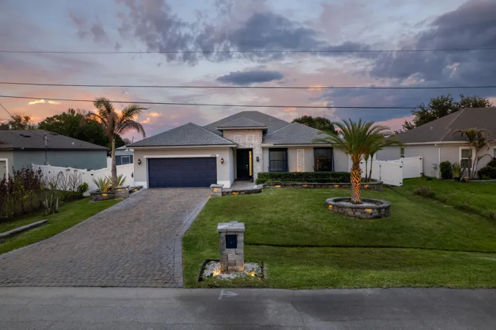 Paved driveway leading to a two-car garage