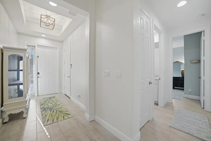 Recessed lighting illuminating wood-finish flooring