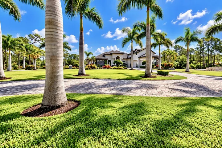 View of Home from Grand Gated Entry...Front of Custom Home 4Bed 4Bath plus Loft with a 3Car Garage