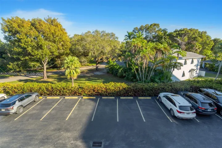 Notice how well laid out the parking lot is and how well the grounds are kept by the Association. There are several dedicated guest parking spaces located to the right side of this picture and almost in front of this unit 206!