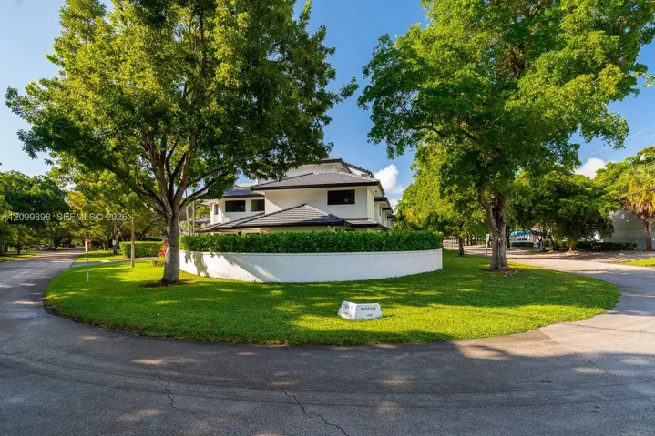 To the right is Madruga St and to the left is Turin Street which has the entrance to the buildings parking Lot! This is a 2 story, 2Bdrm/2.5 Bath Townhouse with over over 990 SF!