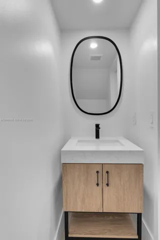 The "Half-Bath is by the Family-room and has a new vanity & mirror & LED lite!.