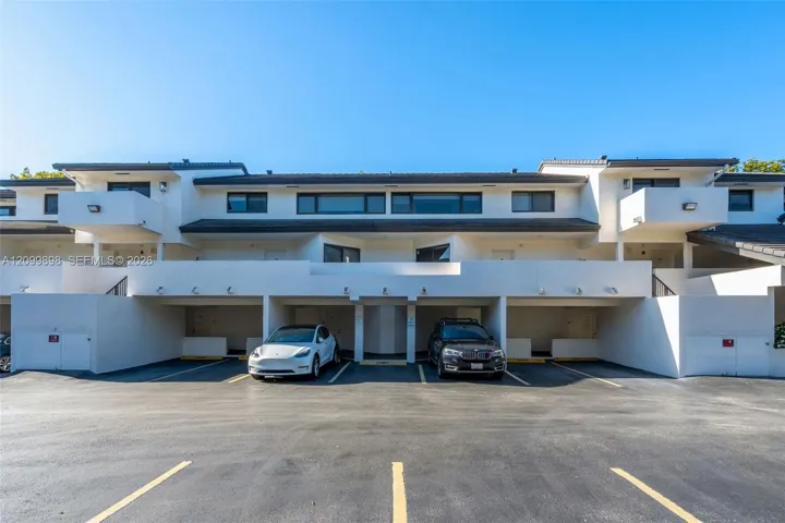 Parking space is #20 & is between the white Tesla and the dark blue BMW! The "Primary Bedroom" has the large balcony to the left of the white Tesla and only 1 other unit in the building has the extended balcony looks out to the South East skyline at treetop heights overlooking a quiet residential neighborhood!