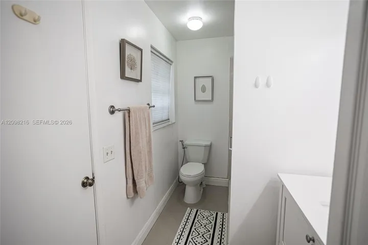 Clean, neutral bathroom with natural light.