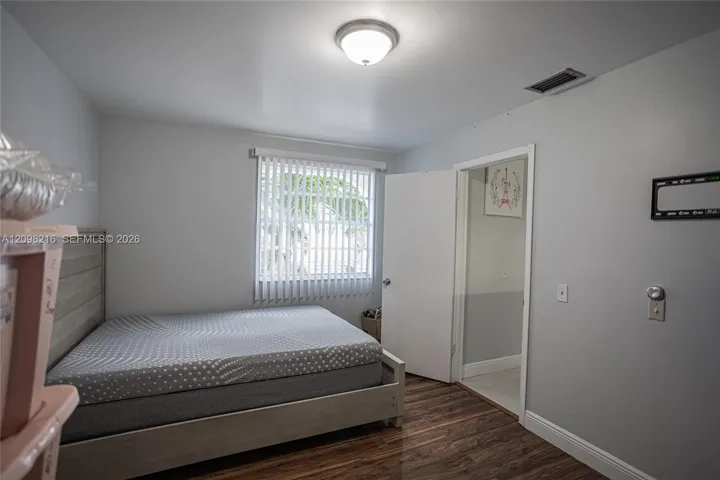 Additional bedroom with a garden facing window and closet space.