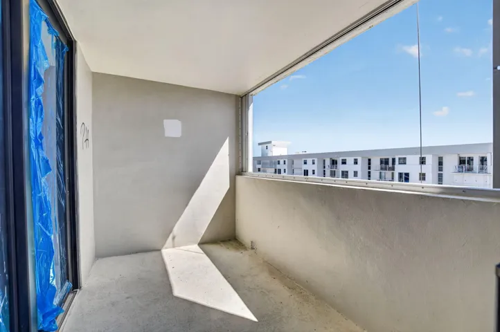 Balcony 1 has views of ocean, blue film for construction purposes.