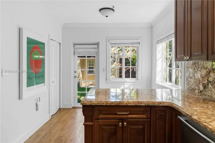 Kitchen offers space for breakfast nook and convenient laundry closet