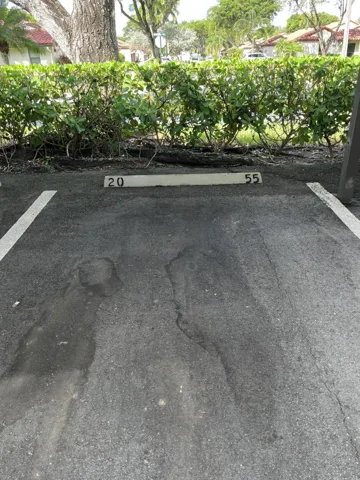 carport parking space #20-55 located directly across from bldg. lobby/elevator area