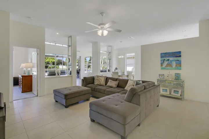 Recessed lighting, tile flooring, ceiling fan, expansive windows