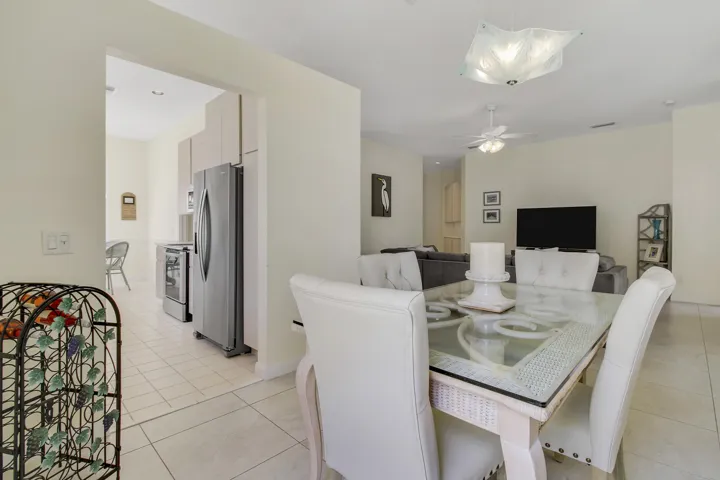 Open-concept dining and living area with tile flooring throughout