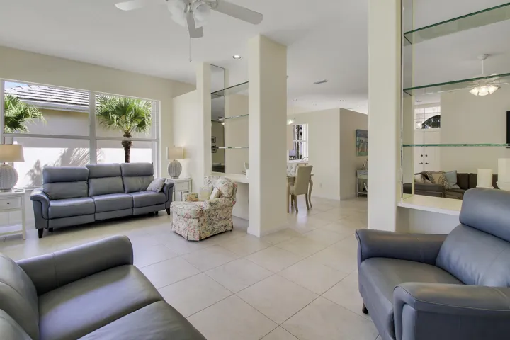 Recessed lighting, ceiling fan, expansive windows, tiled flooring, and built-in glass​​‌​​​​‌​​‌‌​‌‌​​​‌‌​‌​‌​‌​​​‌​​ shelving