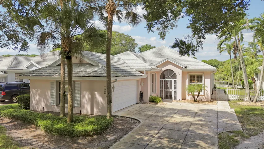 Lakefront CBS construction home with a metal roof.