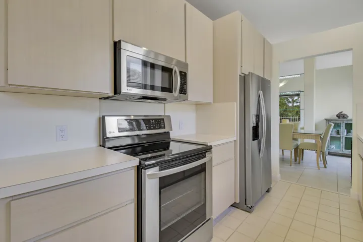 Neutral-toned cabinetry with stainless steel appliances
