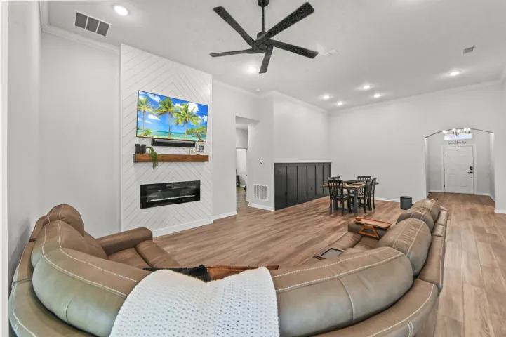 Elegant electric fireplace built into a custom wood entertainment center