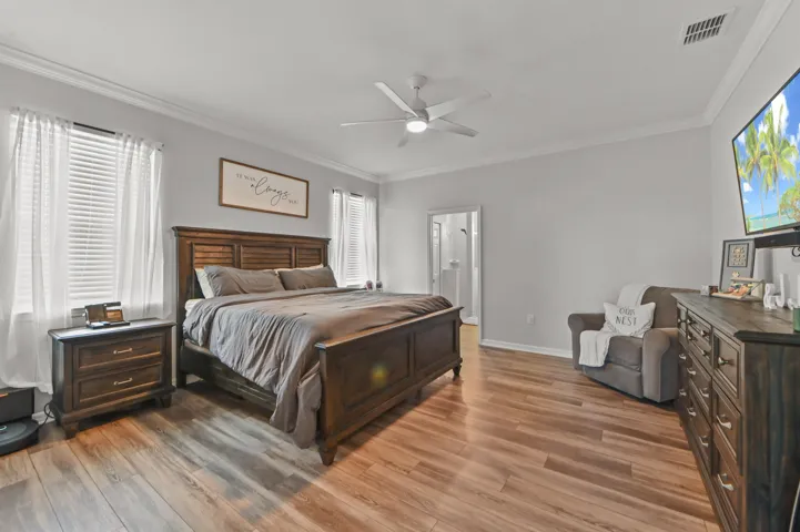 Spacious primary bedroom with 10 ft ceiling & crown moldings