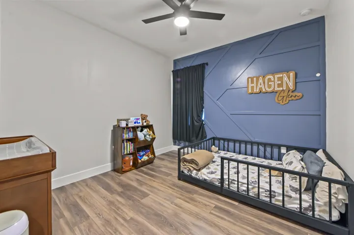 Bedroom #2 with wood style flooring. 3 way split bedroom floor plan