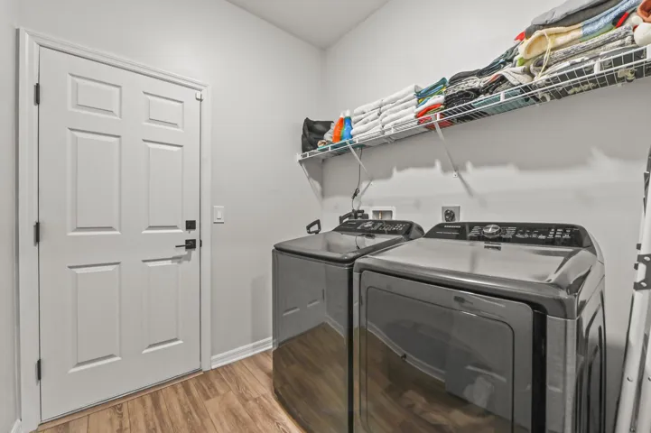 Inside laundry room adjacent to garage