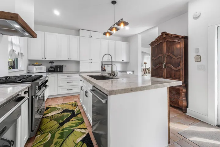 Large kitchen area, 2 sinks, warmer drawer, and 36” range.