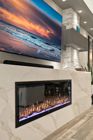 Custom 11’ Waterfall Edge Quartz and 5' Quartz Stacking Stone Chimney Style Fireplace Surround, Multiple Bump-out Entertainment Wall with 13 LED Spotlights & Rope Light on Top