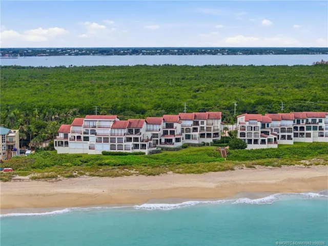 Stunning aerial view of The Dune along the Atlantic shoreline, surrounded by natural coastal landscape with the Indian River beyond.