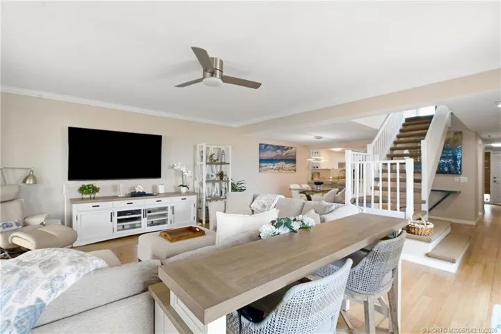 Open living space offers plenty of room for entertaining with the dining area and kitchen conveniently nearby.