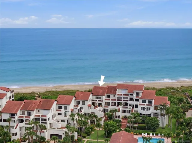 Aerial view highlighting the residence's prime position within the oceanfront community.