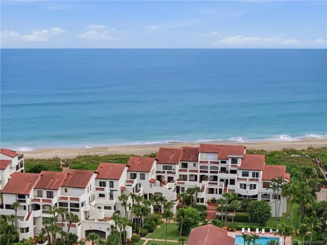 Aerial view identifying the residence within the community and its close proximity to the beach.