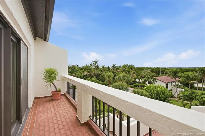 Outdoor terrace off the guest suite overlooking the lush tropical grounds, adding even more private outdoor living space.