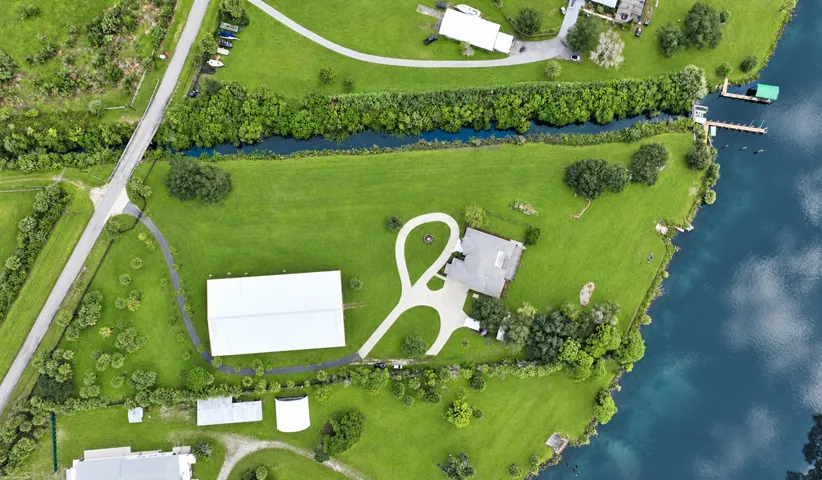 Pristine lakeside estate aerial panorama