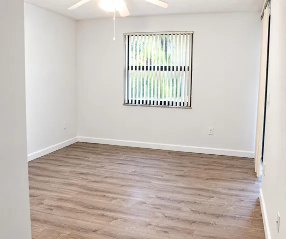 Bright Empty Room with Vertical Blinds